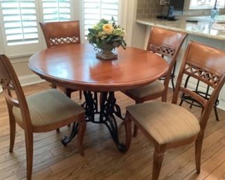 Nichols and stone dining room table and chairs. Table is 46” round with metal base and has four chairs.  Has two leaves.  Purchased at Toms price for $3200.  About 8 yr old. Presale is $1200