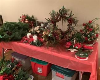 Holiday wreaths and greens and decorations