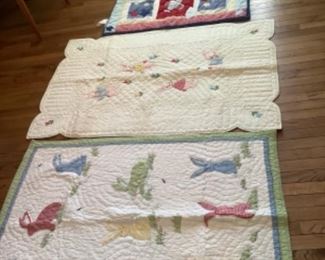 l two handmade Childrens quilts plus airplane quilt and oval pastel rug