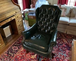 GREEN LEATHER DESK CHAIR. $225.00