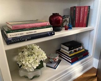 Floral arrangements, vases, books