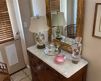 Victorian marble top chest, LaBarge goldleaf mirror, Glass sculpture of a boy, porcelain lamp, Bamboo chair