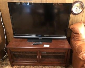 TV stand and Vizio TV.