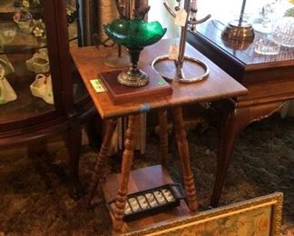 antique lamp table and a vintage long framed litho.