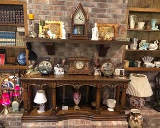 That's a great oak sofa table sitting up on the fireplace hearth. Let's look at what's on it!