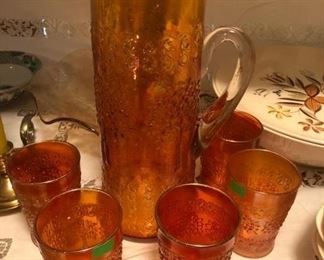 "Orange Tree" carnival glass pitcher and glasses