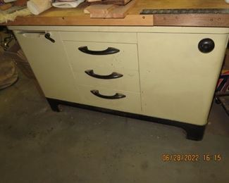 Vintage medical office exam cabinet..should have a padded top for laying on.