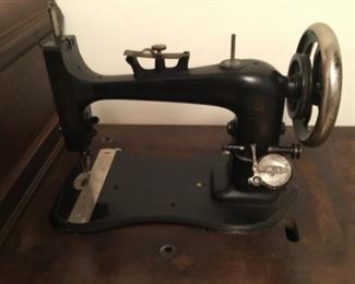 Bedroom- vintage “Domestic” treadle sewing machine - original cabinet with box cover - really neat!