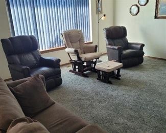 2 leather recliner / rockers. 1 very nice sofa bed.