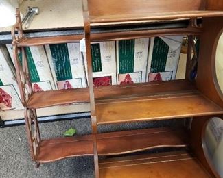 Elegant vintage wall shelves for displaying tea cups and saucers and the like.