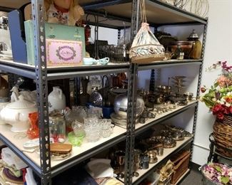 Racks of fun stuff = antique purse, fancy tin boxes, silver, etc.