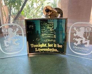 Lowenbrau Lighted Clock Hanging Sign Motion Rotating Vintage Löwenbräu	11x25x25in	HxWxD
