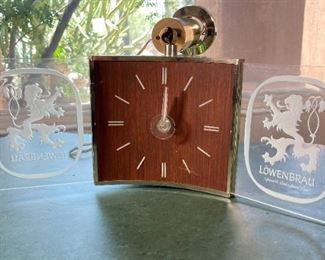 Lowenbrau Lighted Clock Hanging Sign Motion Rotating Vintage Löwenbräu	11x25x25in	HxWxD

