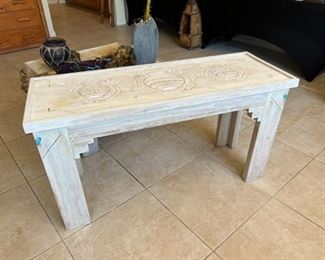 Ornately carved Southwestern console table	25x47.5x17in	HxWxD
