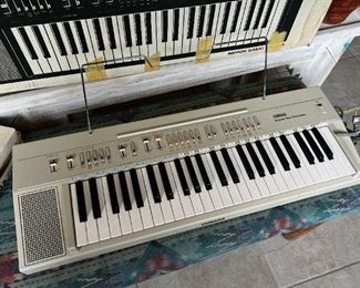 Vintage Yamaha Portable Keyboard Model PS-20 with original box	34x13in	
