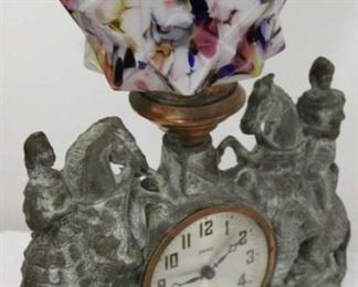 575 - United clock with lamp, end of day glass globe 16 1/2 x 11
