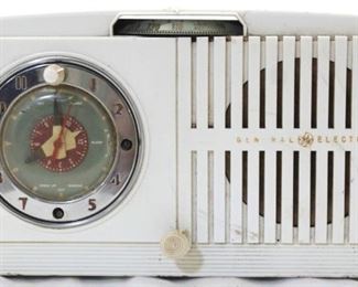 1052 - Vintage General Electric white clock radio 6 tall x 11 long x 5.5 wide
