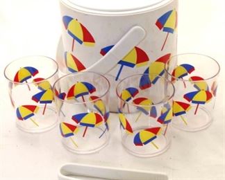 1121 - Umbrella decorated ice bucket with cups and tongs 7 tall x 8 diameter
