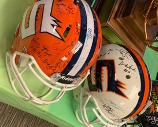 TWO TEAM SIGNED HELMETS