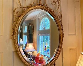Pair of Friedman Brothers "Ashley Hall Adam Oval" mirrors
