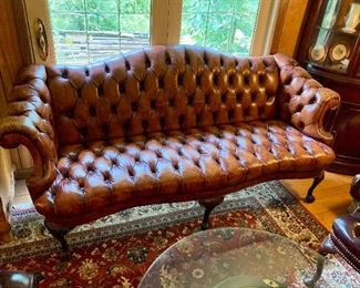 Beautiful patinated saddle brown leather sofa
