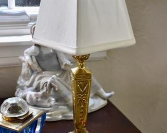 One of a pair of small brass lamps