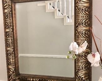 Impressive gold framed mirror