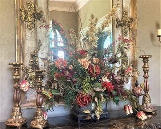 Elegant candleholders and floral arrangement (Mirror stays with the house.)