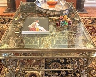 Ornately scrolled wrought iron/ glass top coffee table