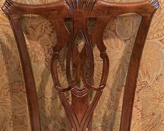 Detailed carving of the 4 chairs