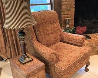 Upholstered arm chair; small accent table; lamp