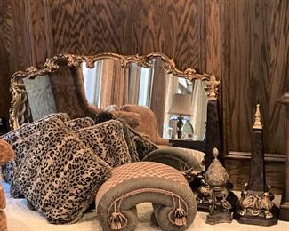 Ornate mirror; pillows; foot stool