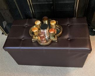 Small leather bench; candles