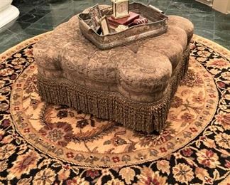 Scalloped ottoman; round rug
