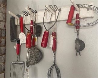 Wooden red handled kitchen utensils