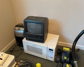 . . .  a coffee maker, microwave, and VCR TV