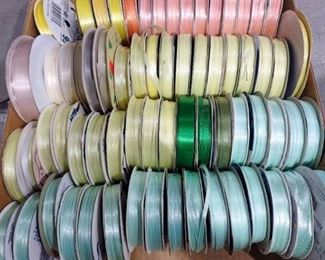 Spools of ribbon greens yellows oranges