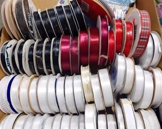 Spools of ribbon whites reds blacks