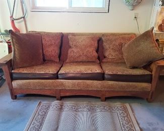 Solid oak Stickley style sofa.  Only recently moved to garage for easy access.