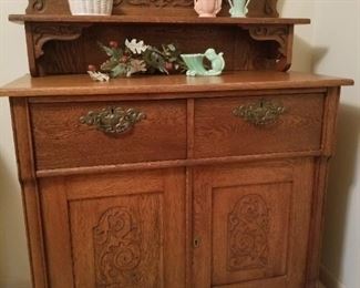 Lovely antique oak side board and McCoy vase