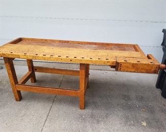Wonderful old solid wood work bench with built in vice. 29 3/4" deep x 35" high x 881/2" wide inc vice and handle