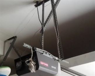 Garage door opener with two remotes