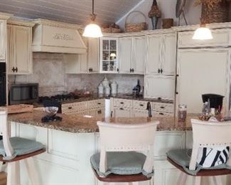 Beautiful kitchen with custom cabinetry. Lots of upper & lower cabinets plus an island