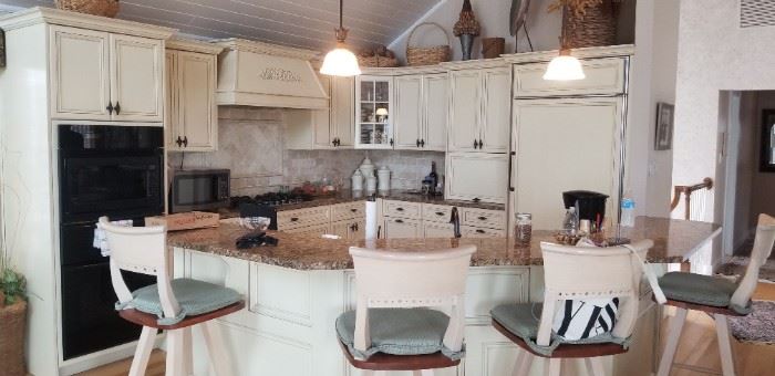 Beautiful kitchen with custom cabinetry. Lots of upper & lower cabinets plus an island