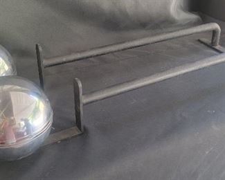 27.  $800.00.   Andirons machine age black with chrome ball.  29” long balls 6”D 
