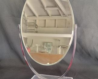 25 CHJ oval mirror double sided as is chip on one side 
19” H mirror alone 12.5” X 9” 
