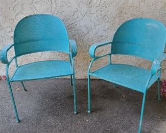 30.  $500.00.   Teal vintage open arm chairs heavy metal chairs need some paint.  Retro! 
31.5” X 24.5” X 20.5”

