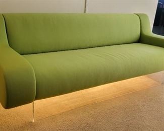 45.  $6,000.00.   Charles Hollis Jones signed green bear sofa.   Lucite base lights up.   29” X 81” X 36” 
