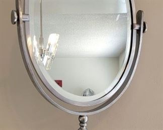 56.  $600.00.  Charles Hollis Jones signed cheval style  mirror.  23”h mirror 16.5” X 11.5” 
