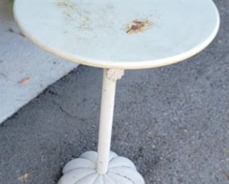 91.  $150.00.    Small round metal table.  21” X 16” 
